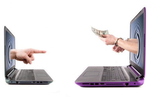laptop money hands technology hands-in-handcuffs-hold-money-1461285622cpu