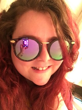 Rae Quigley wearing Edith round multicolor glasses from glassesshop.com