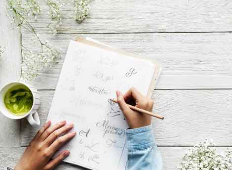 girl writing calligraphy notebook stock photo pexels
